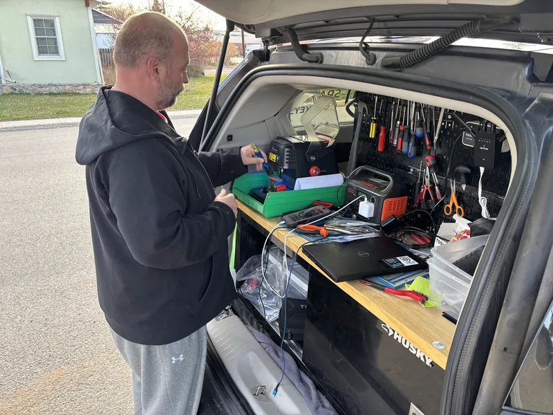 Our technician prepping a key at the mobile workbench in our vehicle in Buffalo, Wyoming