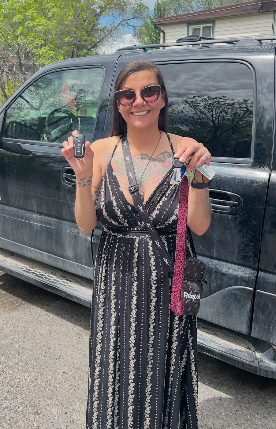 Happy customer in Riverton, Wyoming holding her new car key