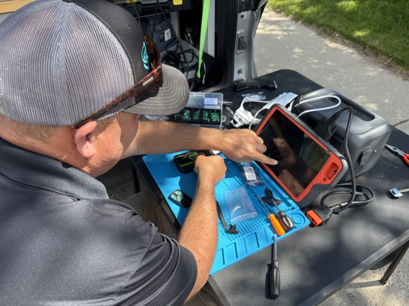 Technician programming a vehicle module on-site in Lander, Wyoming